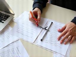 Image of documents or forms being reviewed